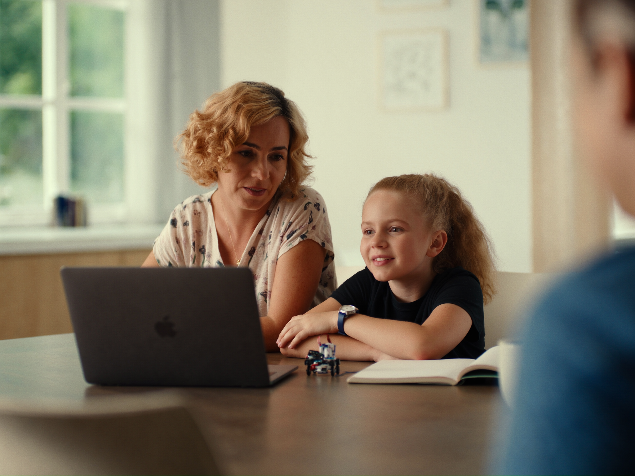 Parent and child building a robot together